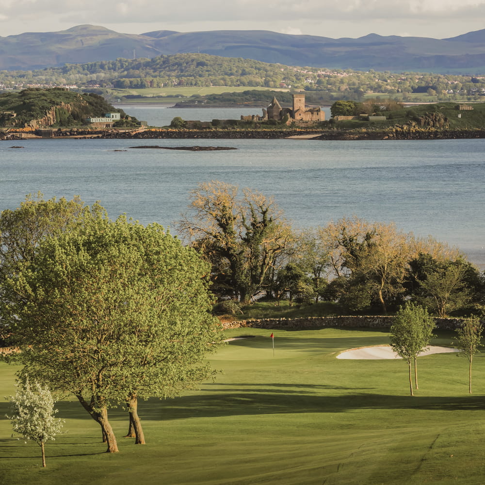 Long shot of scottish golfing greens with ocean in the background. Showcasing our amenity lawn seed, grass lawn seed, lawn grass seed, garden grass seed, seed mixtures, amenity grass, sport grass seed, bowling green, golf greens, golf course grass seed, grass lawn turf, lawn grass turf, turf lawn.